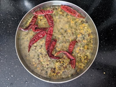 Soak the ingredients along with whole red chillies overnight or for 5 to 6 hours