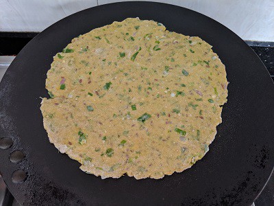 paratha to be cooked on both sides by applying oil or ghee