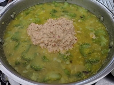 Coconut gravy added to the lentils and vegetables