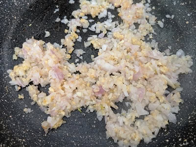 Sauteing the onions and garlic in olive oil for the sauce