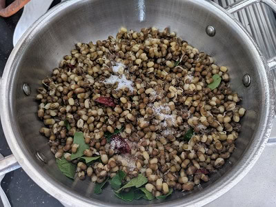 Sprouts and salt added to the tempering