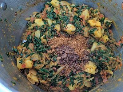 Jaggery powder and garam masala added to the sabzi as final touch