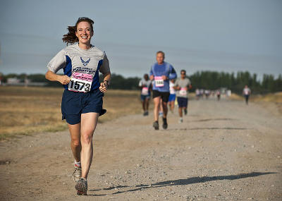 She is running a marathon. (Transitive)