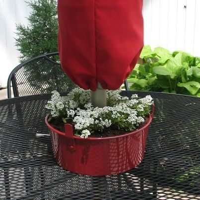 PATIO SET IDEAS AND PUT SOME FLOWERS AT THE END OF THE UMBRELLA
