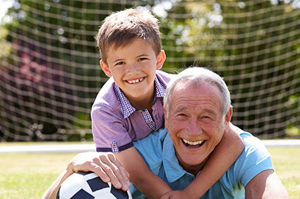 How to Better Hear Your Grandchildren 1 Grandfather can better hear grandchild thanks to hearing help