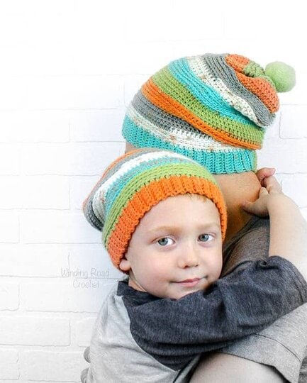 The Daddy and Me slouch Beanie is an easy free crochet pattern. If you know the basic stitches and how to decrease you are good to go. There is a pattern for adult and child sizes. The hat has a unique texture. We used Caron Cupcakes with matching pom pom to create a beautiful set of hats that is great for anyone in your family. #freecrochet #eazy #crochet #crochetpattern #formen #crochetformen