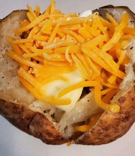 baked potato with butter and cheese