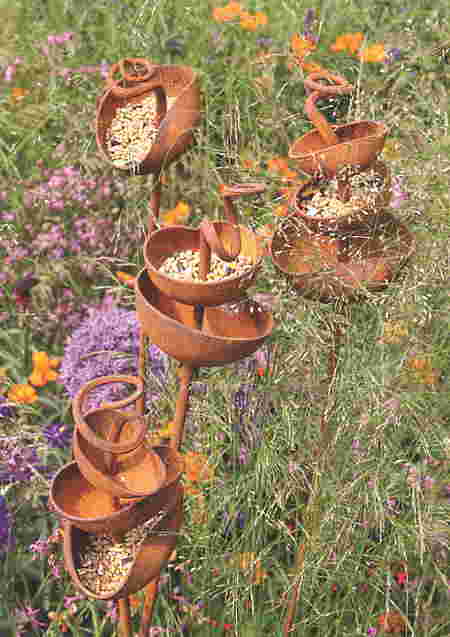Creative Bird Feeders Made With Coconut Shells coconut shells turned into a bird feeder.
