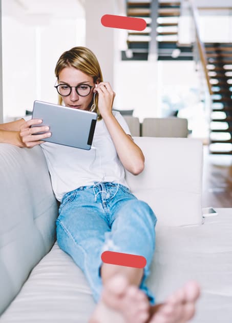 Woman on couch with Ipad