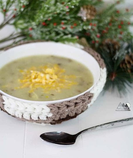 The Plaid Bowl Cozy crochet pattern is perfect for the soup season. This easy pattern uses three colors of yarn to create a plaid look. I have included lots of photos in this tutorial to make it easy for beginners. #crochet #crochetcozy #soupbowl #plaidcrochet