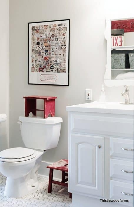 Repose Gray by Sherwin Williams is the perfect warm gray that you've been looking for. It will work in any room in your home, guaranteed! A bathroom paired with repose gray and crisp white trim and vanity