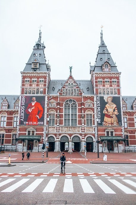 A Non Touristy Weekend Guide To Amsterdam 3 P Cycling in front of the Rijksmuseum, Amsterdam
