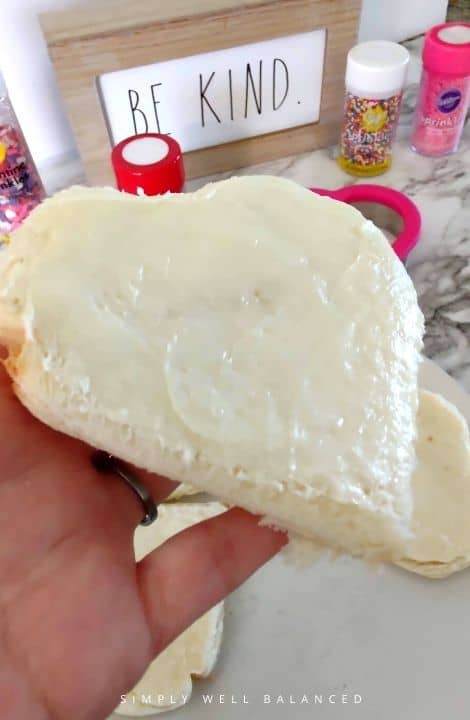 Butter is an important part of making fairy bread that holds on all of the sprinkles.