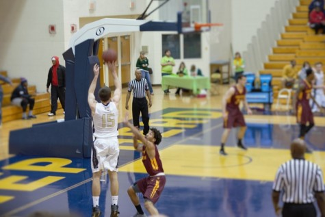 Ryan McTavish pulls up from three over a Charleston defender