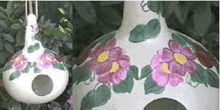 Hand-painted Gourds Hand-painted Gourds. Primarily white with pink and purple floral design.