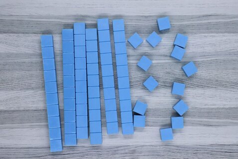 Photo shows 6 blue tens blocks with 14 ones cubes.