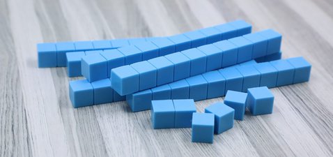 Photo shows a stack of tens blocks with 6 ones blocks.