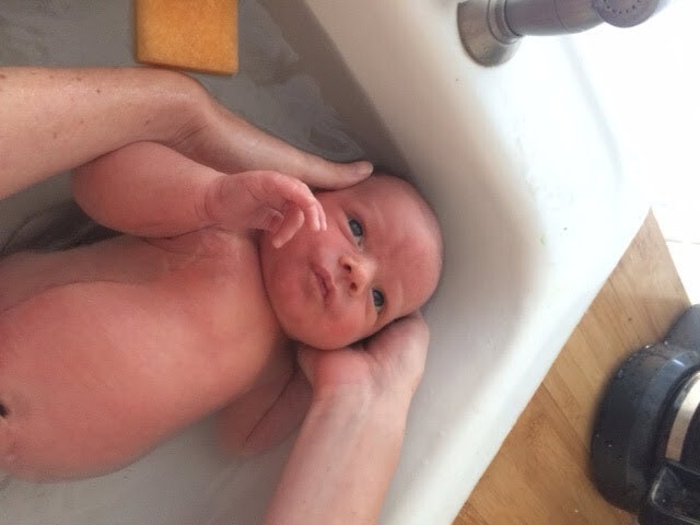 His first real bath, his belly button was ready for the real bath at two weeks :)