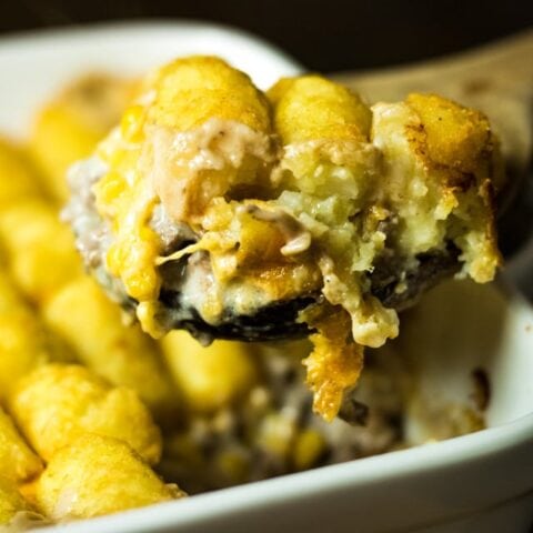 a scoop of Tater tot casserole out of the oven