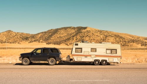 Replacing your camper or trailer's manual tongue jack with an electric trailer jack makes hitching and unhitching a lot easier. SUV towing a travel trailer that doesn't have an electric trailer jack.