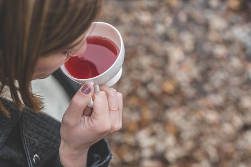 drinking a cup of tea drinking a cup of tea