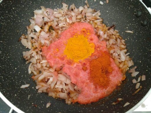 Adding Turmeric and chilli powder