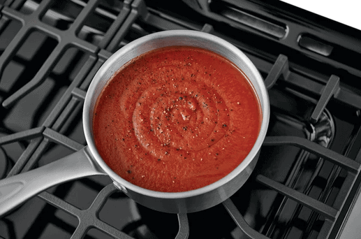 image of food cooking on the rangetop of the Frigidaire_FFGF3054TS