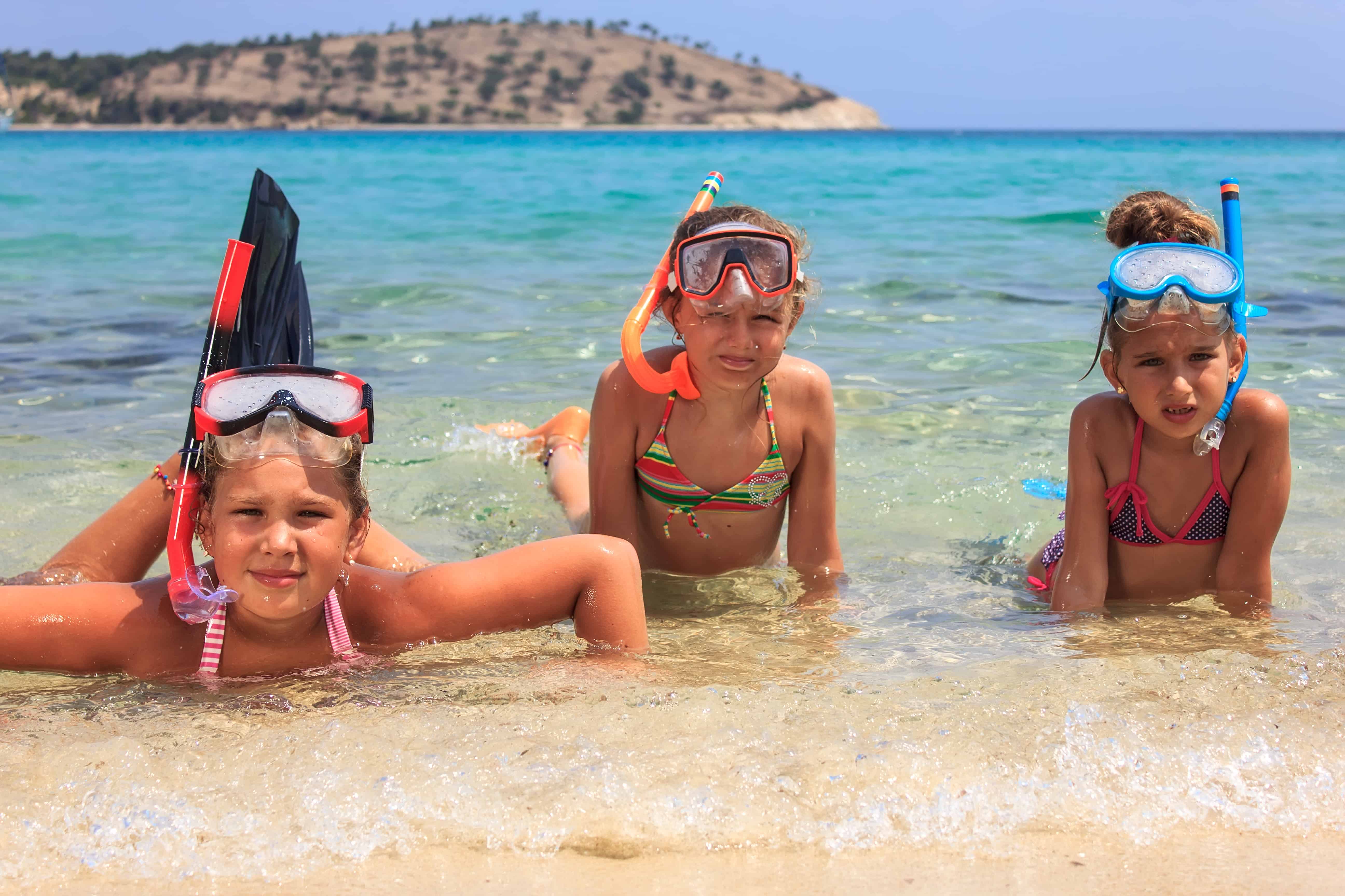 Three girls snorkeling in the ocean Three girls snorkeling in the ocean