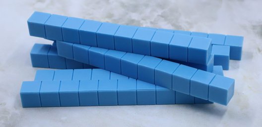Photo shows a stack of blue ten blocks.