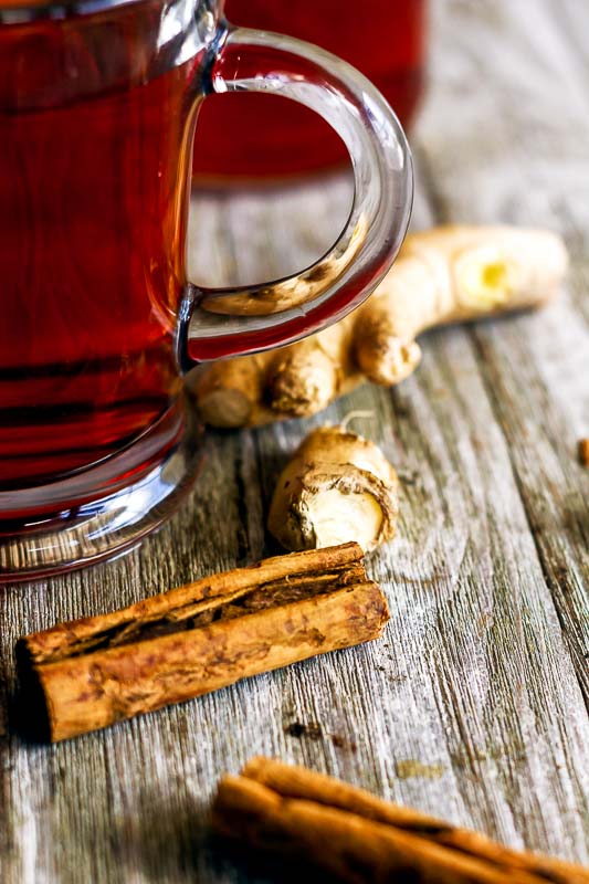 close up of the cinnamon and fresh ginger root used in ginger cinnamon lemon tea