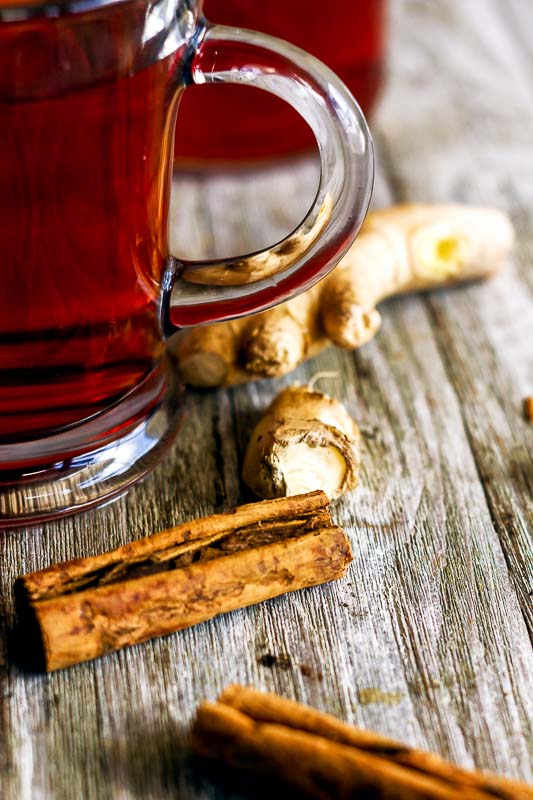 close up of the cinnamon and fresh ginger root used in ginger cinnamon lemon tea 