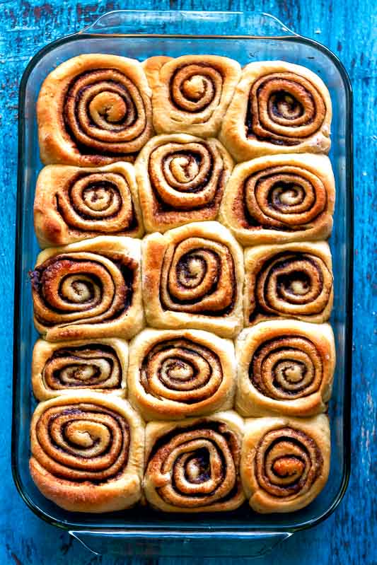 an overhead shot of cinnamon rolls that are better than cinnabon in a glass baking dish