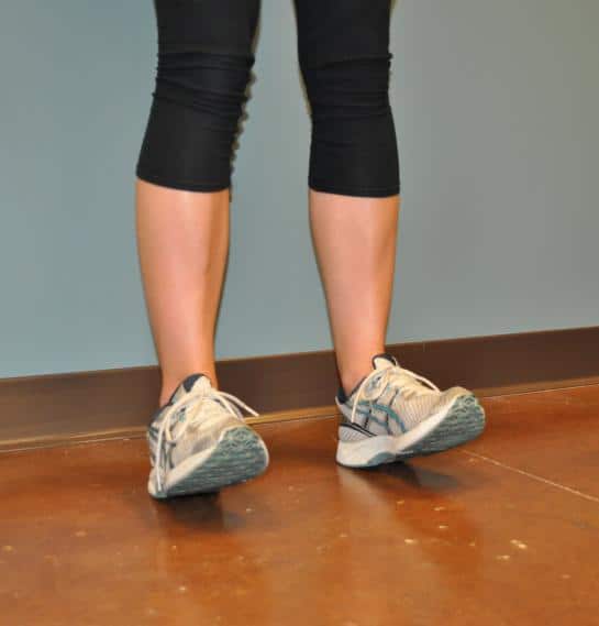 A girl has an exercise for leg muscles