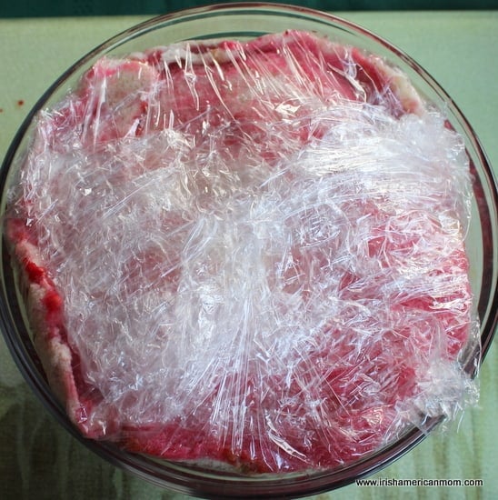 Summer pudding covered in plastic wrap
