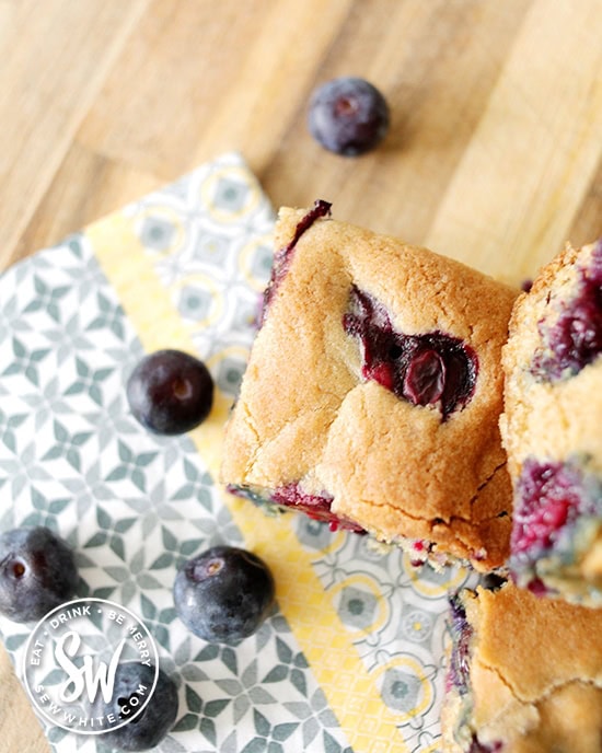 chunky cookie bake studded with blueberries surrounded with fresh blueberries