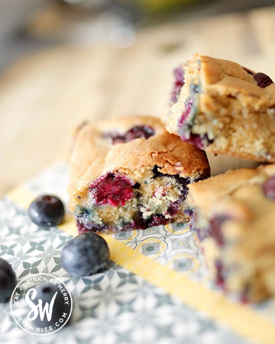 Blueberry Cookie Traybake cut up into slices ready to eat.