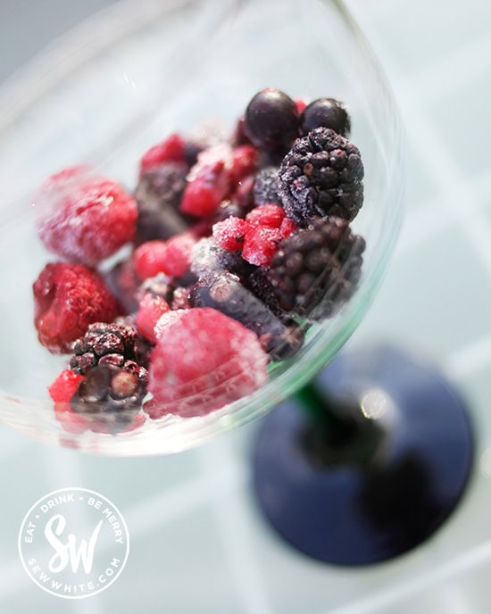 Bright red Summer Berries in a Gin and Tonic glass