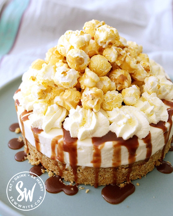 toffee popcorn cheesecake piled high with caramel popcorn