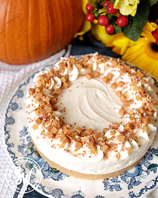 no bake pumpkin spice cheesecake topped with sprinkles and fudge pieces