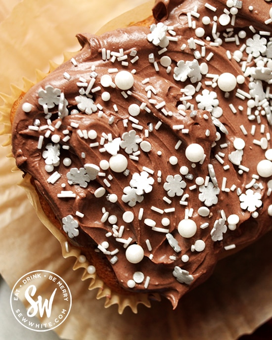 Christmas loaf with the chocolate ganache butter cream and topped with beautiful pearl sprinkles, snowflake sprinkles and white sprinkles