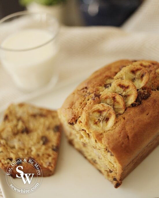 warm Banana Bread with Chocolate Chips decorated with slices of banana