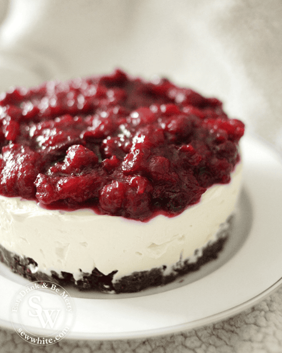 cranberry and orange christmas cheesecake on a bourbon biscuit base