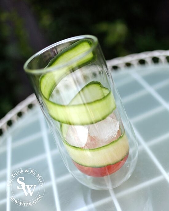 Freshly sliced cucumber strip rapped around the glass for the punch.