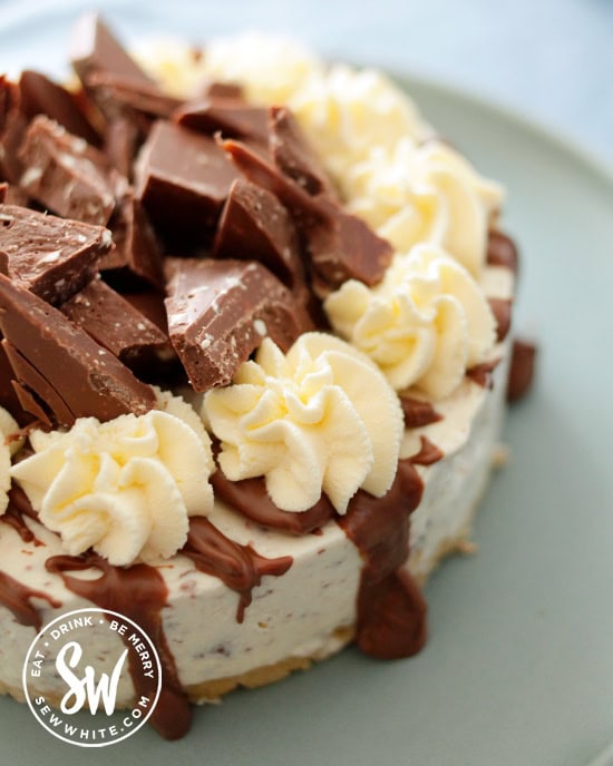 Toberlone cheesecake decorated with pieces of chopped up Toberlone.
