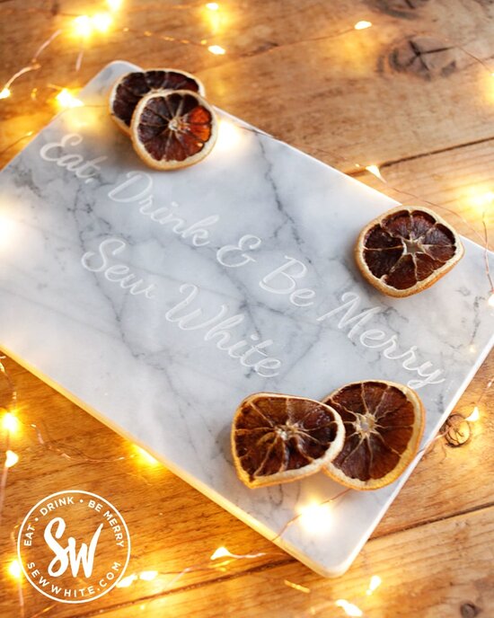 Eat, drink and be merry sew White marble chopping board for the be merry gift guide.