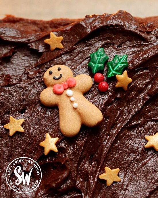 Close up of the gingerbread man cake decoration on top of the Christmas chocolate traybake