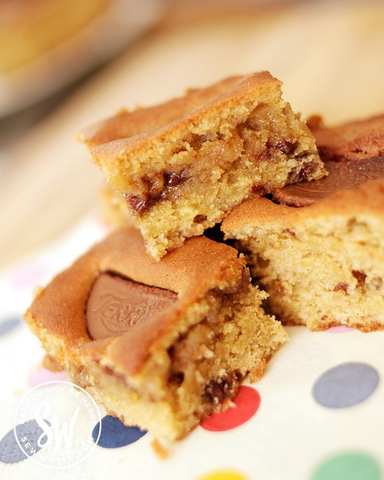 chocolate orange cookie traybake slice showing a gooey cookie piece