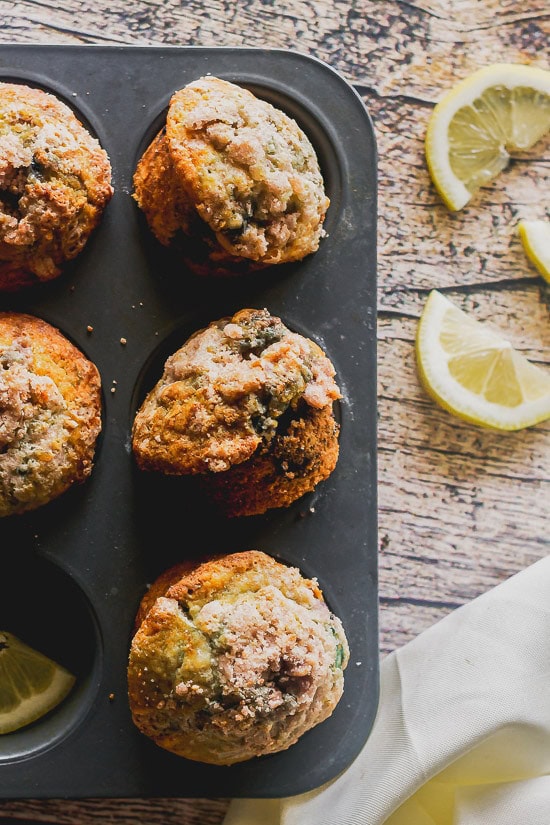 overhead shot of bakery style blueberry muffins in their pan