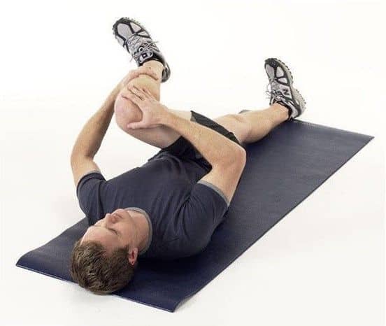 Knee to the opposite shoulder, lower back pain exercise