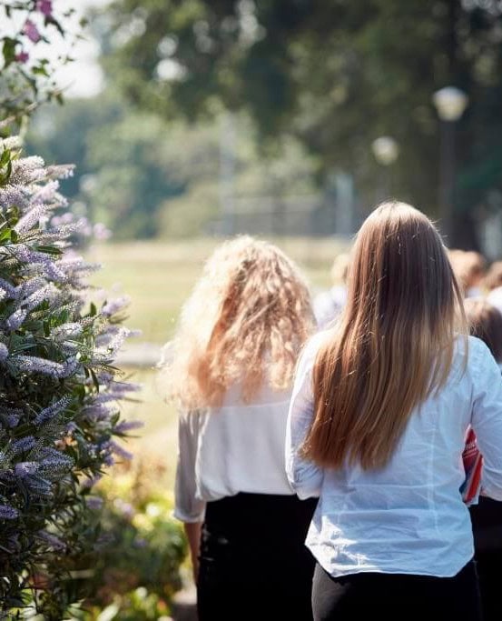 Girls walking between classes